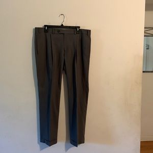 Pants  green with buttons that are up . button down upper